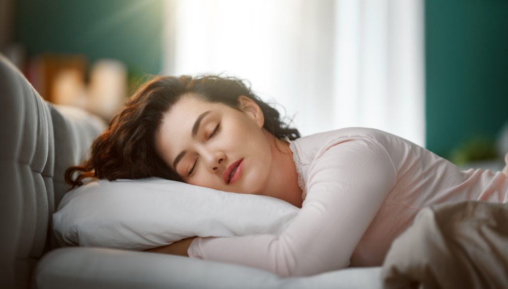 woman is sleeping in the bedroom